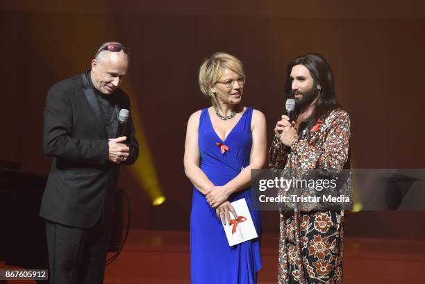 Stefan Hippler, Andrea Ballschuh and Conchita Wurst attend the 12th Hope Charity Gala at Kulturpalast on October 28, 2017 in Dresden, Germany.
