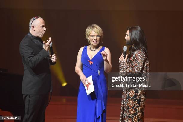 Stefan Hippler, Andrea Ballschuh and Conchita Wurst attend the 12th Hope Charity Gala at Kulturpalast on October 28, 2017 in Dresden, Germany.