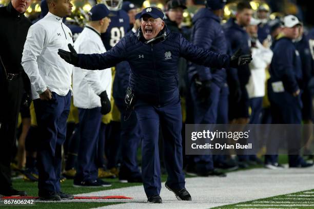 Head coach Brian Kelly of the Notre Dame Fighting Irish reacts after a play in the fourth quarter against the North Carolina State Wolfpack at Notre...