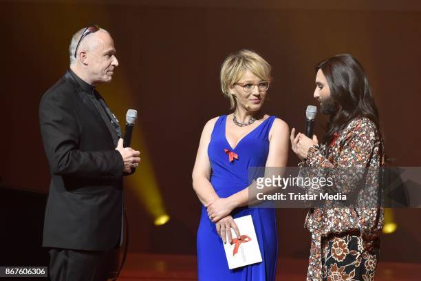 Stefan Hippler, Andrea Ballschuh and Conchita Wurst attend the 12th Hope Charity Gala at Kulturpalast on October 28, 2017 in Dresden, Germany.