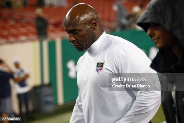 Head coach Charlie Strong of the South Florida Bulls walks off the field following the Bulls loss to the Houston Cougars at an NCAA football game on...