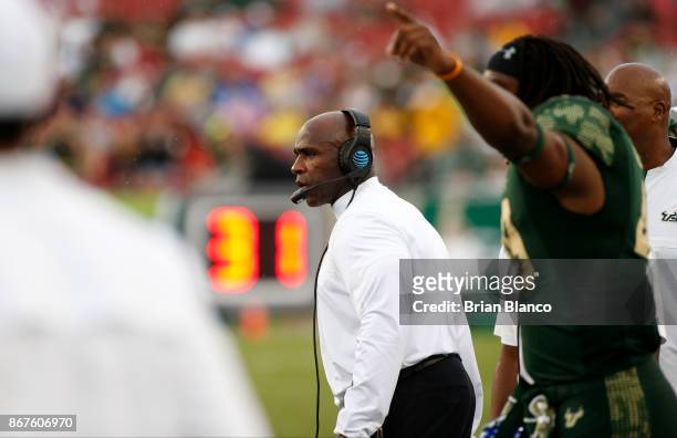 Head coach Charlie Strong of the South Florida Bulls looks on from the sidelines during the third quarter of an NCAA football game against the...