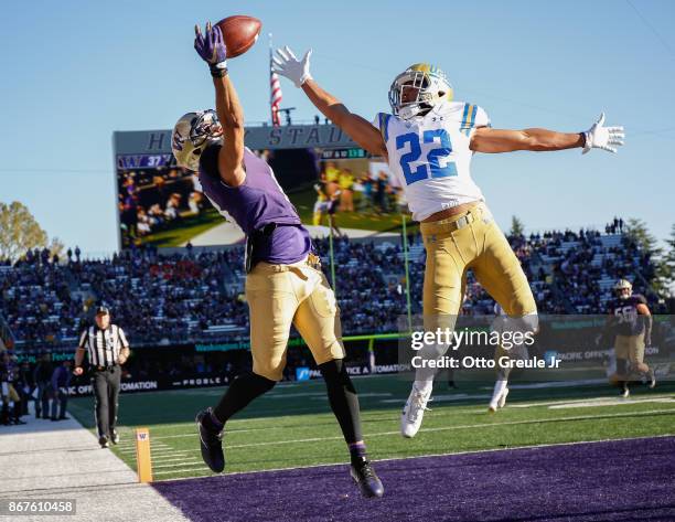 Wide receiver Dante Pettis of the Washington Huskies just misses making a touchdown catch against defensive back Nate Meadors of the UCLA Bruins at...