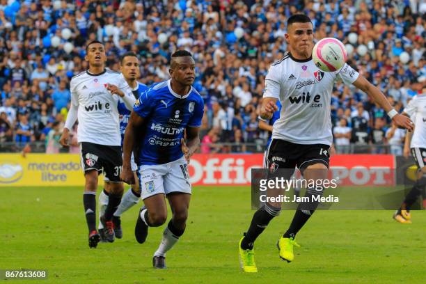 Yerson Candelo of Queretaro and Luis Reyes of Atlas fight for the ball during the 15th round match between Queretaro and Atlas as part of the Torneo...