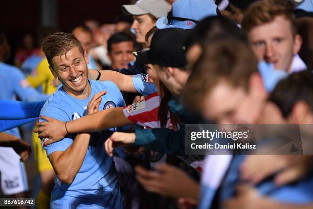 Stefan Mauk of Melbourne City celebrates with fans after the round four A-League match between Adelaide United and Melbourne City FC at Coopers...