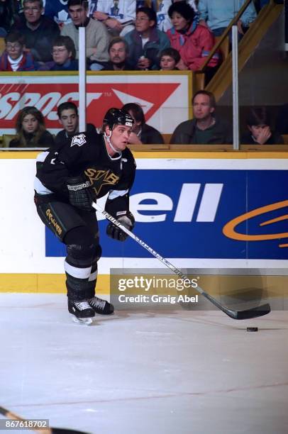 Derian Hatcher of the Dallas Stars skates against the Toronto Maple Leafs during NHL game action on December 9, 1995 at Maple Leaf Gardens in...