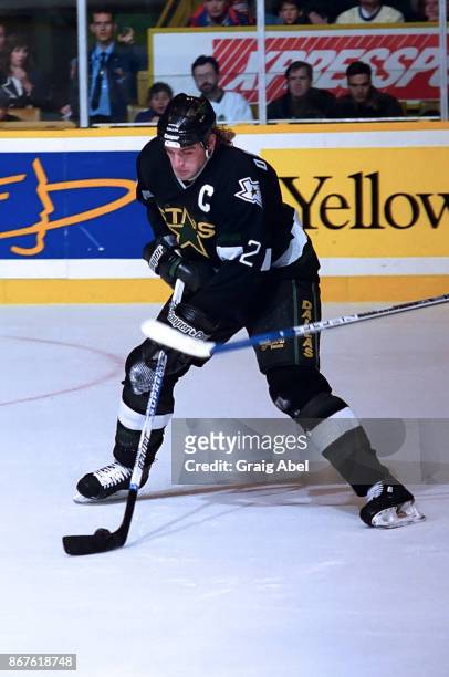 Derian Hatcher of the Dallas Stars skates against the Toronto Maple Leafs during NHL game action on December 9, 1995 at Maple Leaf Gardens in...