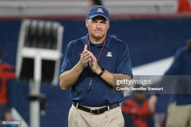 Head coach Rich Rodriguez of the Arizona Wildcats looks on during warm ups prior to the game against the Washington State Cougars at Arizona Stadium...