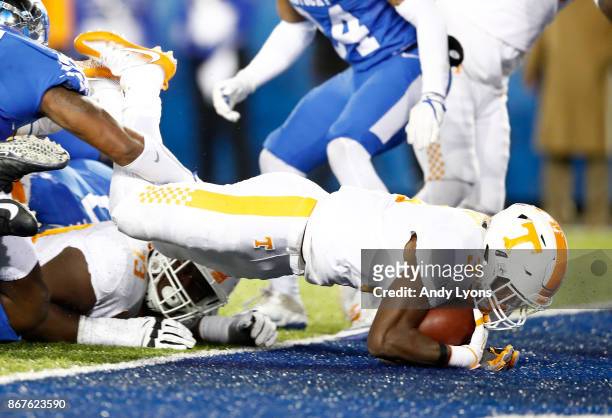 Ty Chandler of the Tennessee Volunteers dives in for a touchdown against the Kentucky Wildcats at Commonwealth Stadium on October 28, 2017 in...