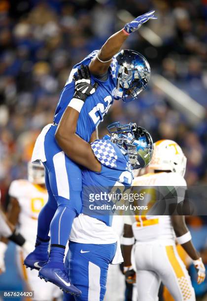 Benny Snell Jr of the Kentucky Wildcats celebrates with Jervontius Stallings after scoring a touchdown against the Tennessee Volunteers at...