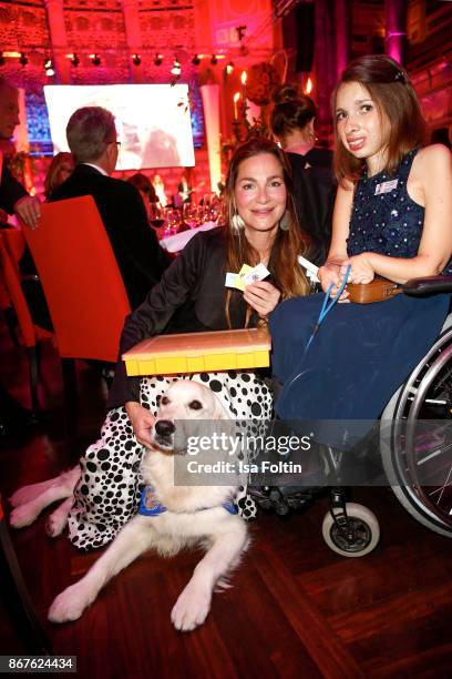 German actress Alexandra Kamp with the Vita-Team Pauline Bader and her dog Quandace during the 8th VITA Charity Gala on October 28, 2017 in...