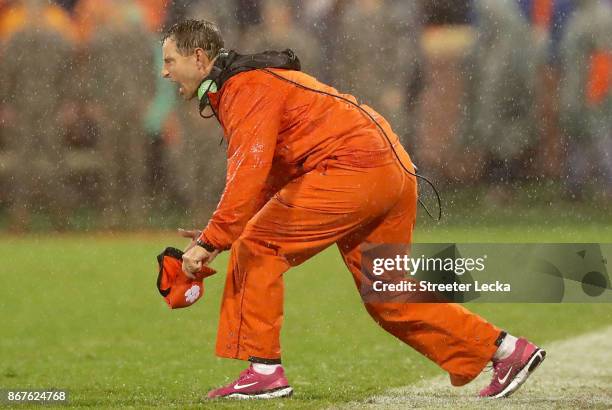 Head coach Dabo Swinney of the Clemson Tigers yells to his team during their game against the Georgia Tech Yellow Jackets at Memorial Stadium on...