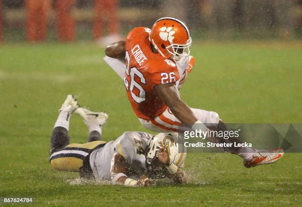 Corey Griffin of the Georgia Tech Yellow Jackets tackles Adam Choice of the Clemson Tigers during their game at Memorial Stadium on October 28, 2017...