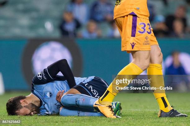 Milos Ninkovic of Sydney FC is hurt after a tackle during the round four A-League match between Sydney FC and the Perth Glory at Allianz Stadium on...