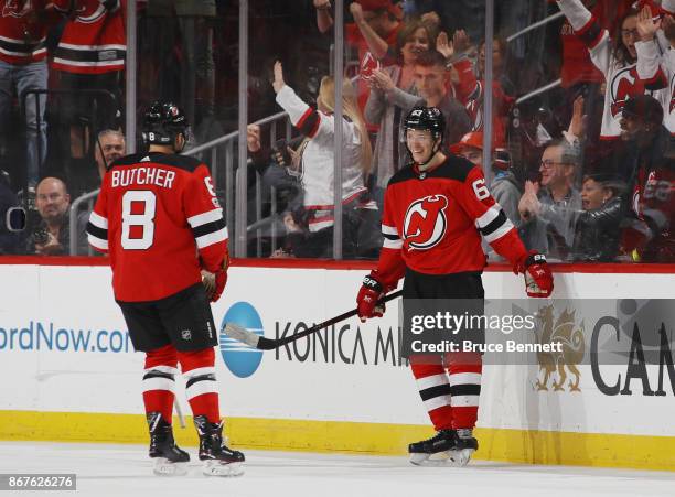 Jesper Bratt of the New Jersey Devils celebrates his game winning powerplay goal at 15:47 of the third period against the Arizona Coyotes and is...