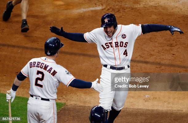 George Springer of the Houston Astros celebrates after hitting a solo home run during the sixth inning against the Los Angeles Dodgers in game four...