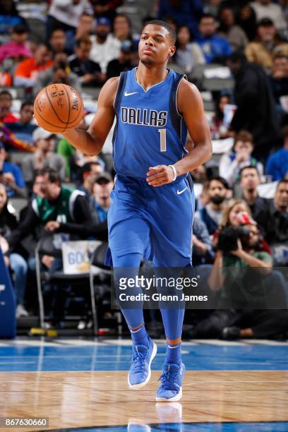 Dennis Smith Jr. #1 of the Dallas Mavericks handles the ball against the Philadelphia 76ers on October 28, 2017 at the American Airlines Center in...