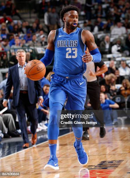 Wesley Matthews of the Dallas Mavericks handles the ball against the Philadelphia 76ers on October 28, 2017 at the American Airlines Center in...