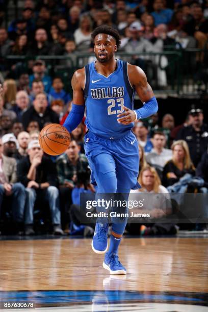 Wesley Matthews of the Dallas Mavericks handles the ball against the Philadelphia 76ers on October 28, 2017 at the American Airlines Center in...
