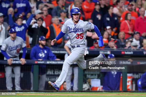 Cody Bellinger of the Los Angeles Dodgers reacts as he scores on a Logan Forsythe single during the seventh inning against the Houston Astros in game...