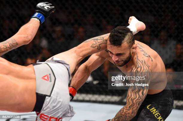 Marlon Vera of Ecuador kicks John Lineker of Brazil in their bantamweight bout during the UFC Fight Night event inside the Ibirapuera Gymnasium on...