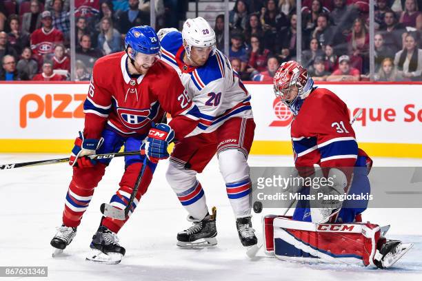 Goaltender Carey Price of the Montreal Canadiens makes a save near teammate Jeff Petry and Chris Kreider of the New York Rangers during the NHL game...
