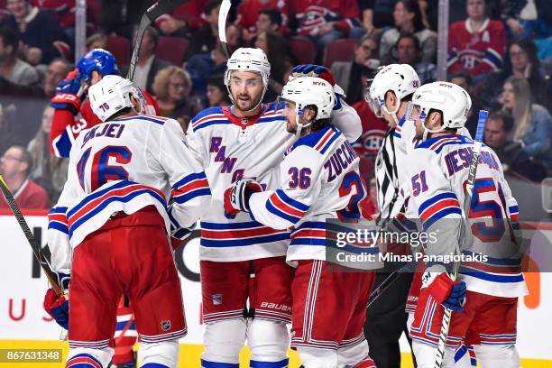 Kevin Shattenkirk, Mats Zuccarello, David Desharnais and Chris Kreider celebrate a third period goal by teammate Brady Skjei of the New York Rangers...