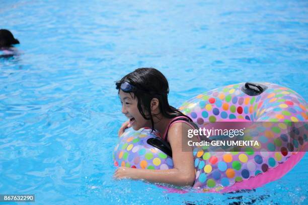 girls swimming in the pool - clear water foto e immagini stock