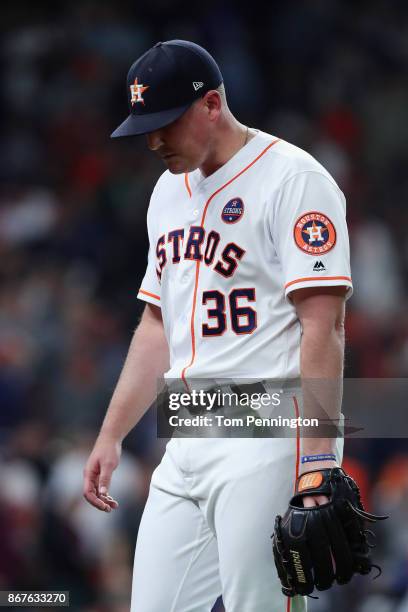 Will Harris of the Houston Astros looks on after giving up a run during the seventh inning against the Los Angeles Dodgers in game four of the 2017...