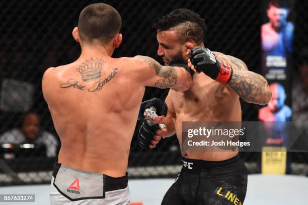 Marlon Vera of Ecuador punches John Lineker of Brazil in their bantamweight bout during the UFC Fight Night event inside the Ibirapuera Gymnasium on...