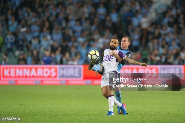 Diego Castro of Perth Glory is tackled by Sydney FC's Luke Wilkshire during the round four A-League match between Sydney FC and the Perth Glory at...