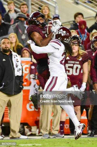 Mississippi State Bulldogs defensive back Lashard Durr strips the ball from Texas A&M Aggies wide receiver Jhamon Ausbon during second half action...