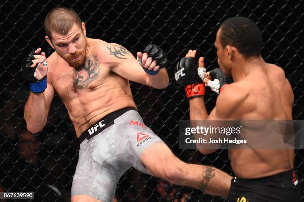 Jim Miller kicks Francisco Trinaldo of Brazil in their lightweight bout during the UFC Fight Night event inside the Ibirapuera Gymnasium on October...