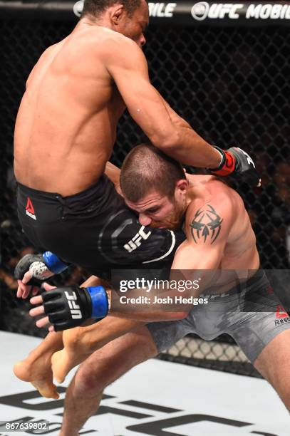 Francisco Trinaldo of Brazil lands a knee to the face of Jim Miller in their lightweight bout during the UFC Fight Night event inside the Ibirapuera...
