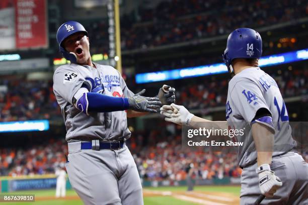 Joc Pederson of the Los Angeles Dodgers celebrates after hitting a three-run home run during the ninth inning against the Houston Astros in game four...