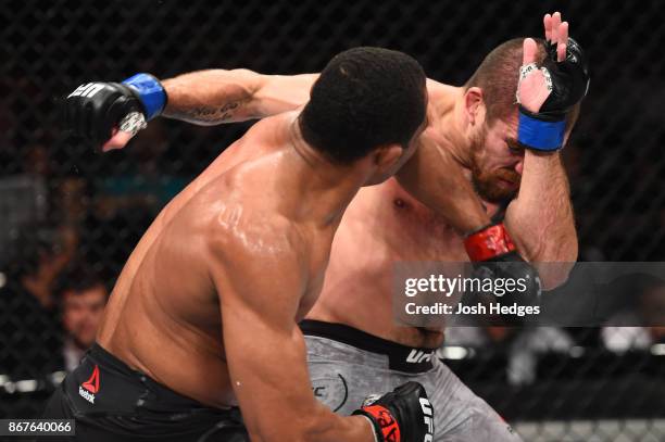 Francisco Trinaldo of Brazil punches Jim Miller in their lightweight bout during the UFC Fight Night event inside the Ibirapuera Gymnasium on October...