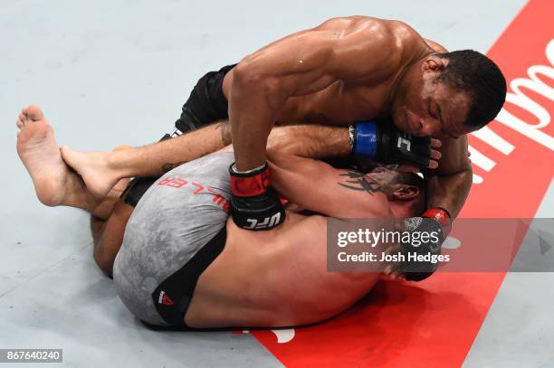 Francisco Trinaldo of Brazil punches the body of Jim Miller in their lightweight bout during the UFC Fight Night event inside the Ibirapuera...