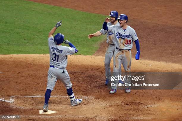 Joc Pederson of the Los Angeles Dodgers celebrates hitting a three-run home run during the ninth inning against the Houston Astros in game four of...