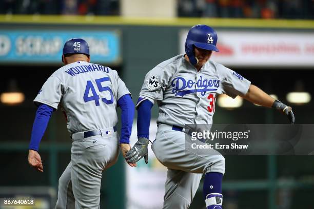 Joc Pederson of the Los Angeles Dodgers celebrates after hitting a three-run home run during the ninth inning against the Houston Astros in game four...