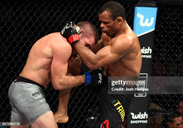Francisco Trinaldo of Brazil lands a knee against Jim Miller in their lightweight bout during the UFC Fight Night event inside the Ibirapuera...