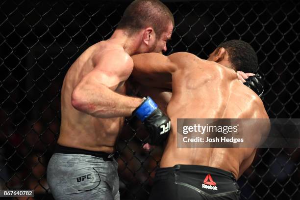 Francisco Trinaldo of Brazil lands a elbow to the chin of Jim Miller in their lightweight bout during the UFC Fight Night event inside the Ibirapuera...