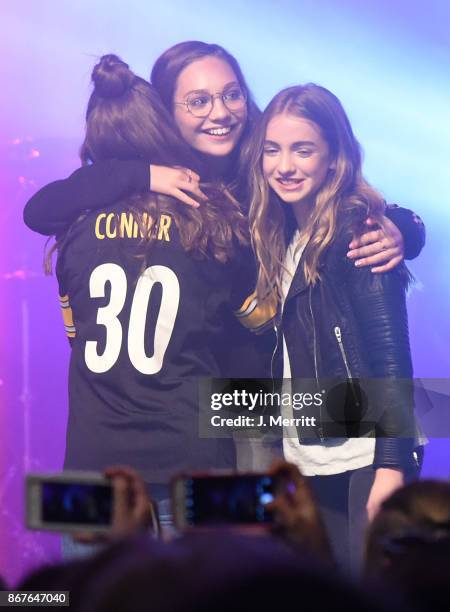 Maddie Ziegler celebrates on stage with Johnny Orlando & Mackenzie Ziegler during their "Day & NIght" tour at Mr Smalls on October 28, 2017 in...