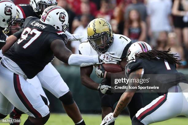 South Carolina Gamecocks defensive lineman Kobe Smith and defensive back JaMarcus King tackle Vanderbilt Commodores running back Ralph Webb during...