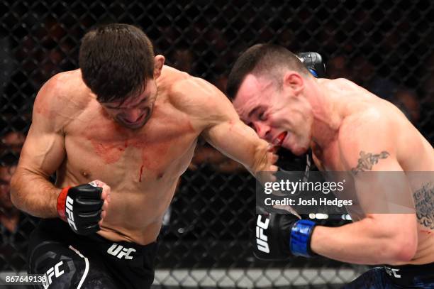 Demian Maia of Brazil punches Colby Covington in their welterweight bout during the UFC Fight Night event inside the Ibirapuera Gymnasium on October...