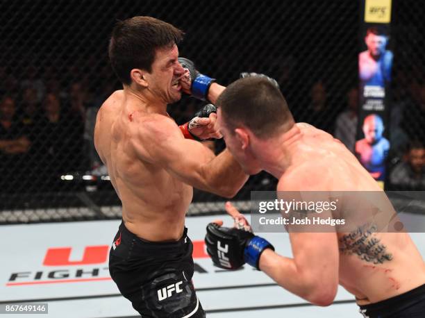 Colby Covington punches Demian Maia of Brazil in their welterweight bout during the UFC Fight Night event inside the Ibirapuera Gymnasium on October...