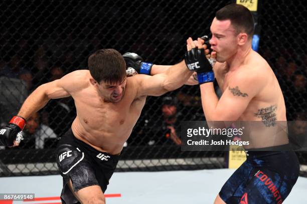 Demian Maia of Brazil punches Colby Covington in their welterweight bout during the UFC Fight Night event inside the Ibirapuera Gymnasium on October...