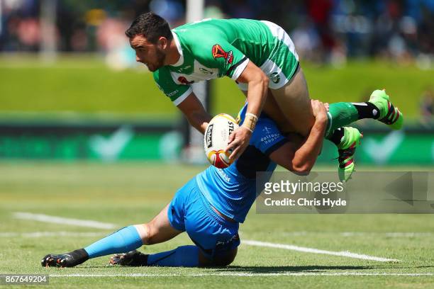 Api Pewhairangi of Ireland is tackled by Nathan Milone of Italy during the 2017 Rugby League World Cup match between Ireland and Italy at Barlow Park...