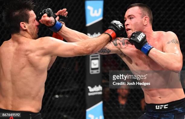 Colby Covington punches Demian Maia of Brazil in their welterweight bout during the UFC Fight Night event inside the Ibirapuera Gymnasium on October...