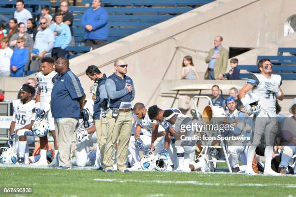 Columbia Lions teammates kneel during the national anthem prior to the start during the game between the Yale Bulldogs and the Columbia Lions on...