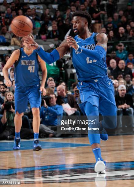 Wesley Matthews of the Dallas Mavericks handles the ball against the Philadelphia 76ers on October 28, 2017 at the American Airlines Center in...